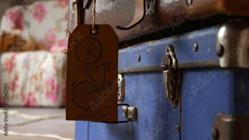 Tag on the suitcase is swinging.