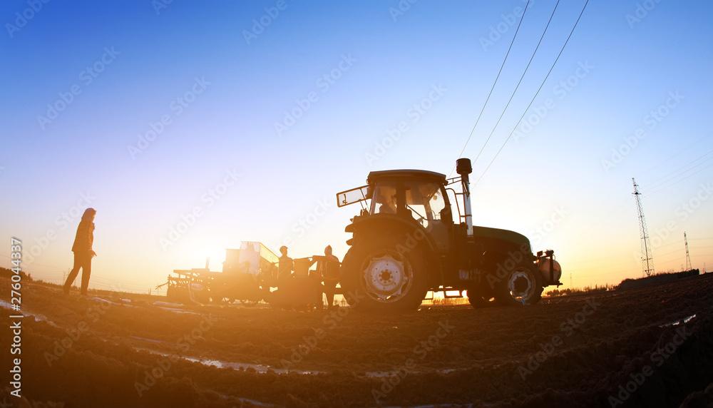 Fototapeta premium The tractor in farmland farming