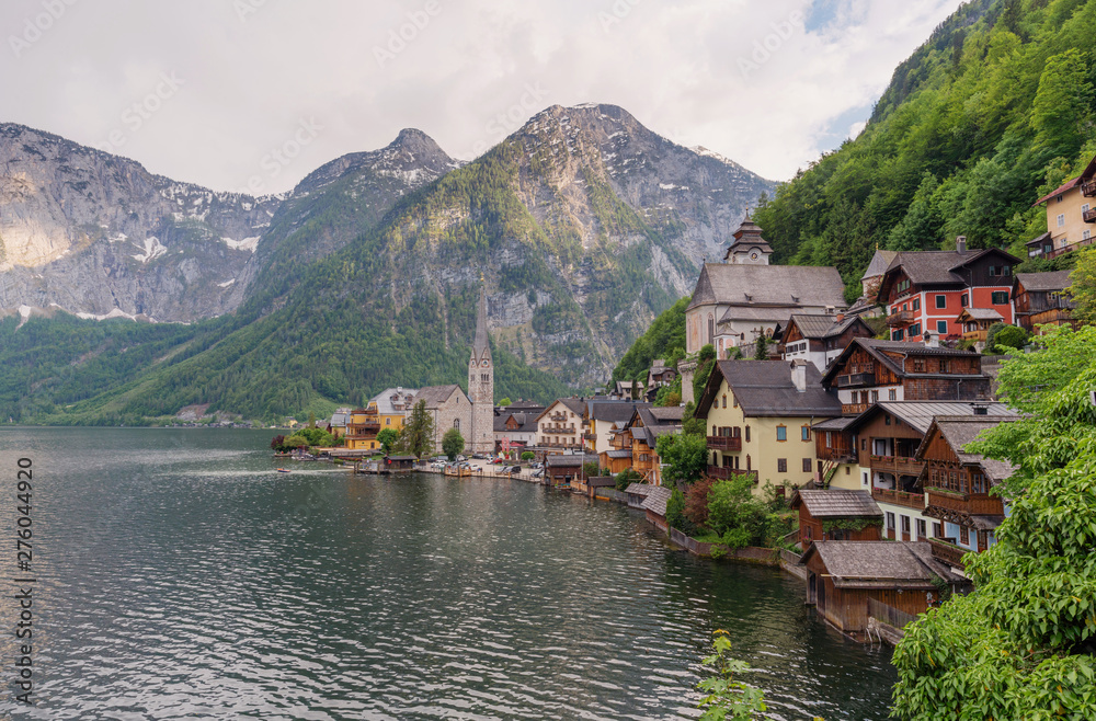 Panoramic lake with mountain and Hallstatt village in summer, famous landmark and travel destination in Austria