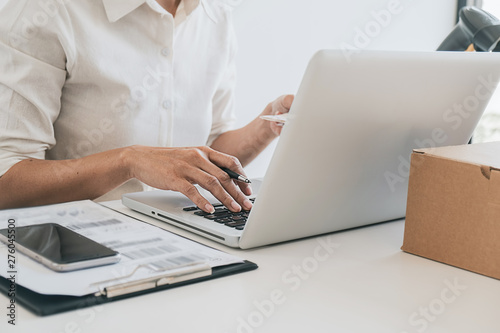 Online shopping concept. Young women receive parcels from online order.