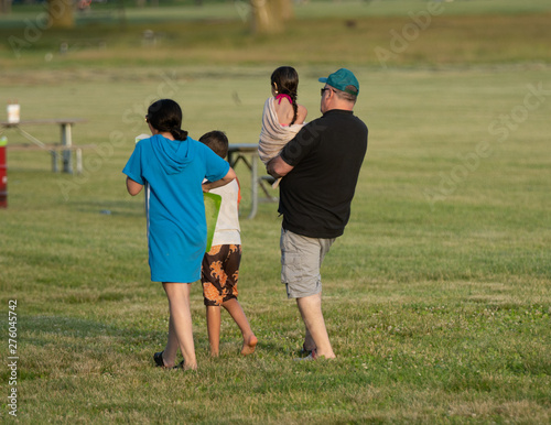 unknown single dad takes his kids to the picnic