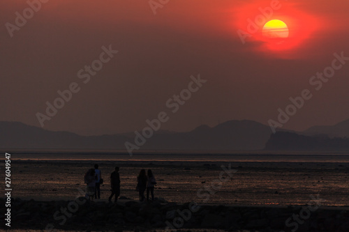 the sunset and people of Ansan's tandohang Port.
