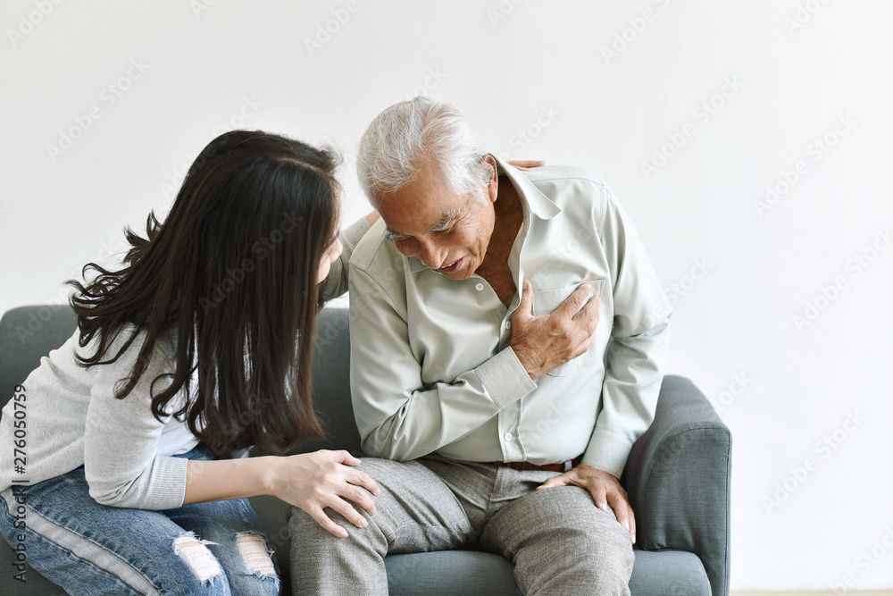 Heart attack disease problem in old man, Elderly asian man with hand on chest gesture, Daughter frighten and worry about her father chest pain symptom, Senior healthcare insurance concept.