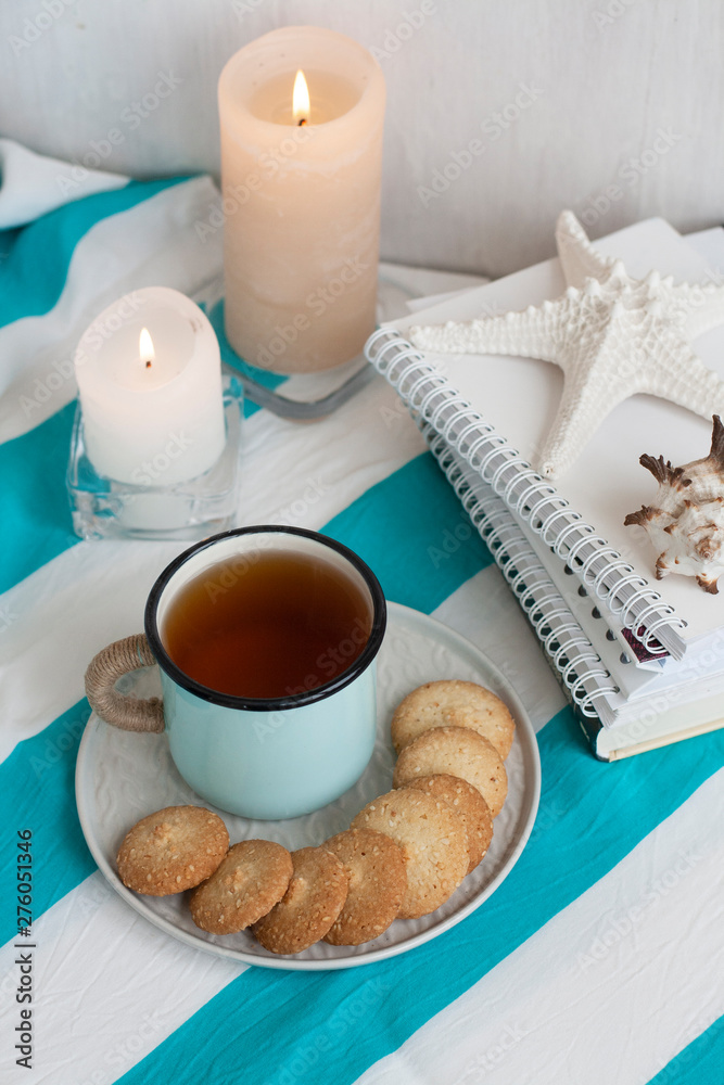 A study break: a mug of tea with cookies on a side. A study break: a mug of tea with cookies on a side.