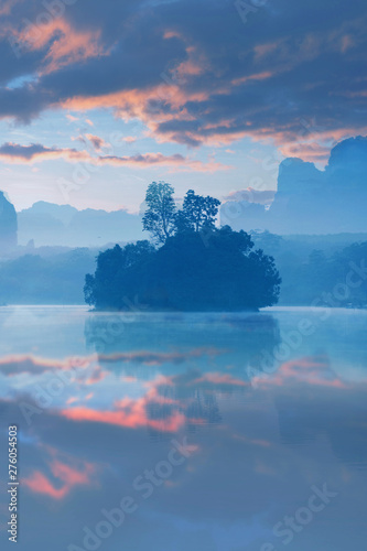 Vertical image of Lake view a Baan Nong Thale in Krabi, Thailand during sunrise with beautiful cloud.