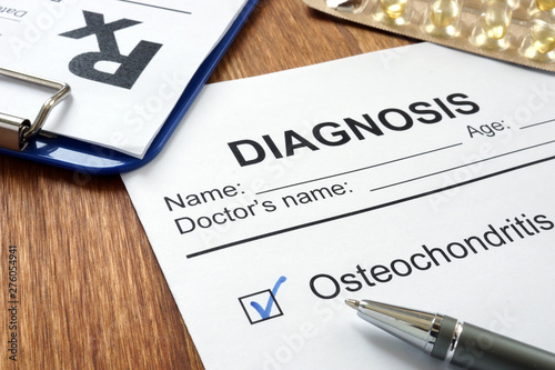 Diagnosis osteochondritis and prescription form on desk. photo
