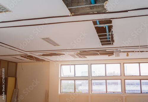 repair leak water pipe on gypsum ceiling interior office building