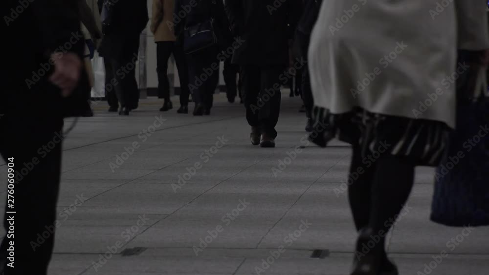 TOKYO, JAPAN - CIRCA APRIL 2019 : Scenery of RUSH HOUR at SHINJUKU. Back shot of unidentified crowd of people going back to home from work at night. TOKYO, JAPAN - CIRCA APRIL 2019 : Scenery of RUSH HOUR at SHINJUKU. Back shot of unidentified crowd of people going back to home from work at night.