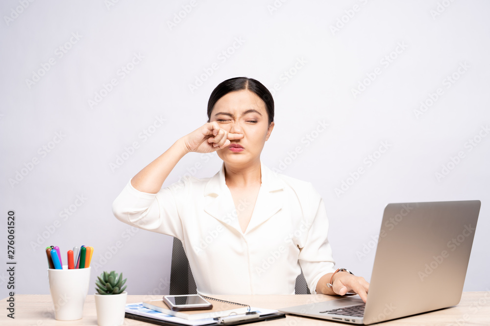 Woman wipe her nose at office isolated white background Woman wipe her nose at office isolated white background