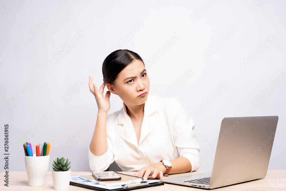 Woman scratching her head at office isolated white background Woman scratching her head at office isolated white background