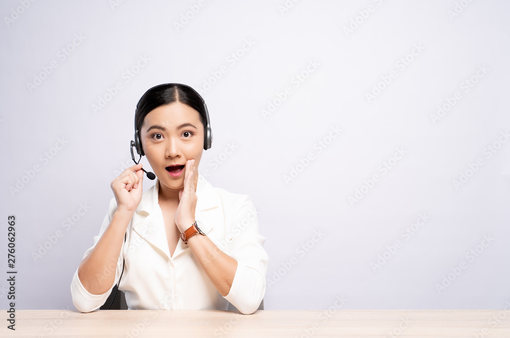Woman operator in headset make whisper gesture over white background Woman operator in headset make whisper gesture over white background