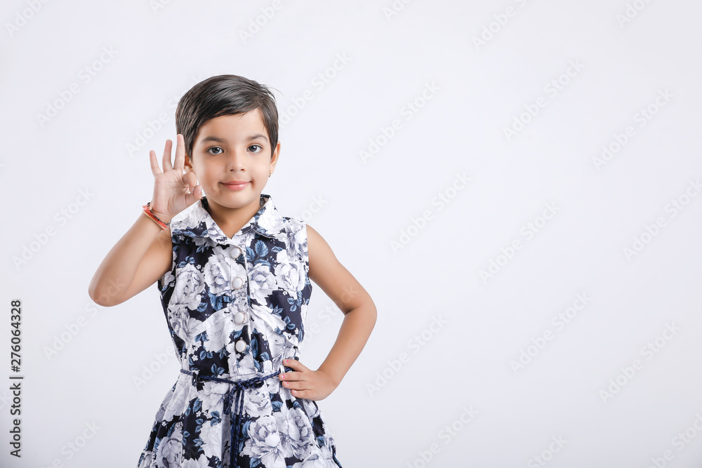 Indian little girl showing direction with hand Indian little girl showing direction with hand