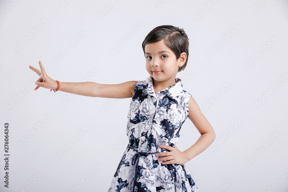 Indian little girl showing direction with hand Indian little girl showing direction with hand