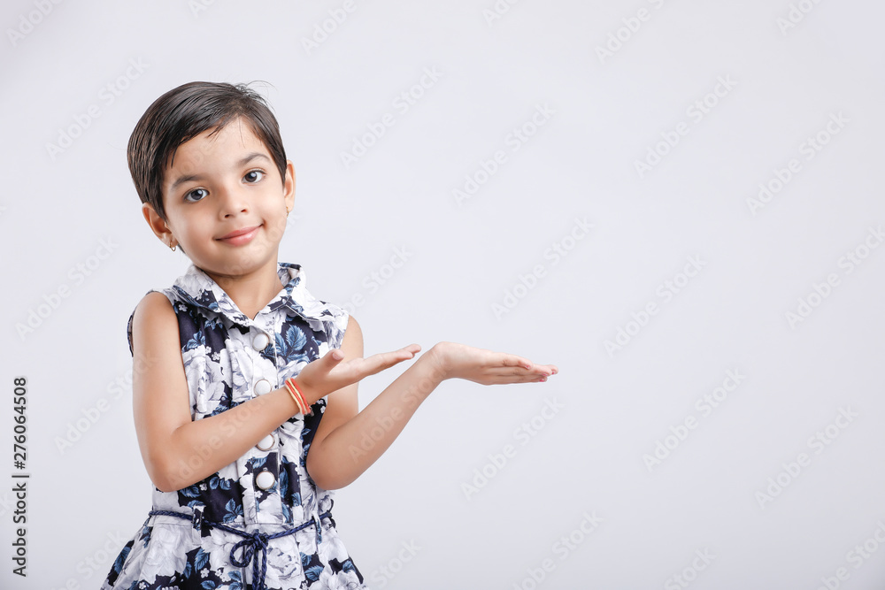 Indian little girl showing direction with hand Indian little girl showing direction with hand