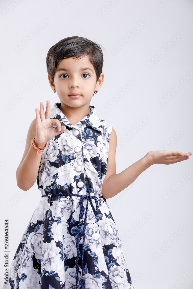 Indian little girl showing direction with hand Indian little girl showing direction with hand