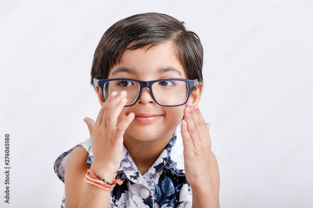 Cute indian little girl wearing spectacles