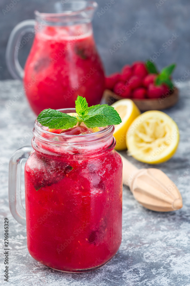 Refreshing raspberry, lemon and mint lemonade with sparkling water in jar, vertical Refreshing raspberry, lemon and mint lemonade with sparkling water in jar, vertical