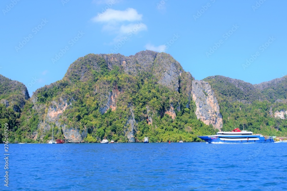 Beautiful view of the rocks and boat in thailand