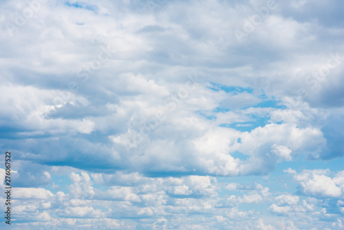 Fototapeta Naklejka Na Ścianę i Meble -  Beautiful white cumulonimbus clouds against the background of the bright blue sky