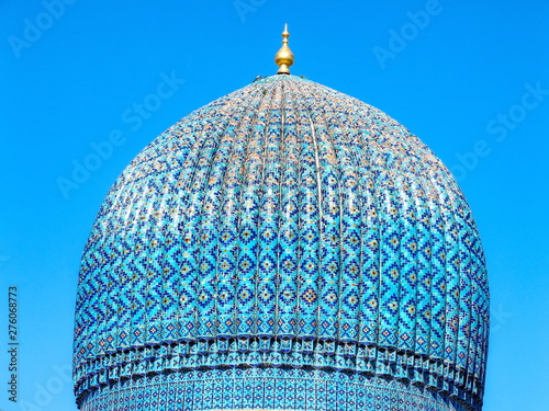 Traditional and ancient islamic art. Blue and turquoise tiles in the ceramic dome of Gur Emir mausoleum. City of Samarkand, Uzbekistan photo