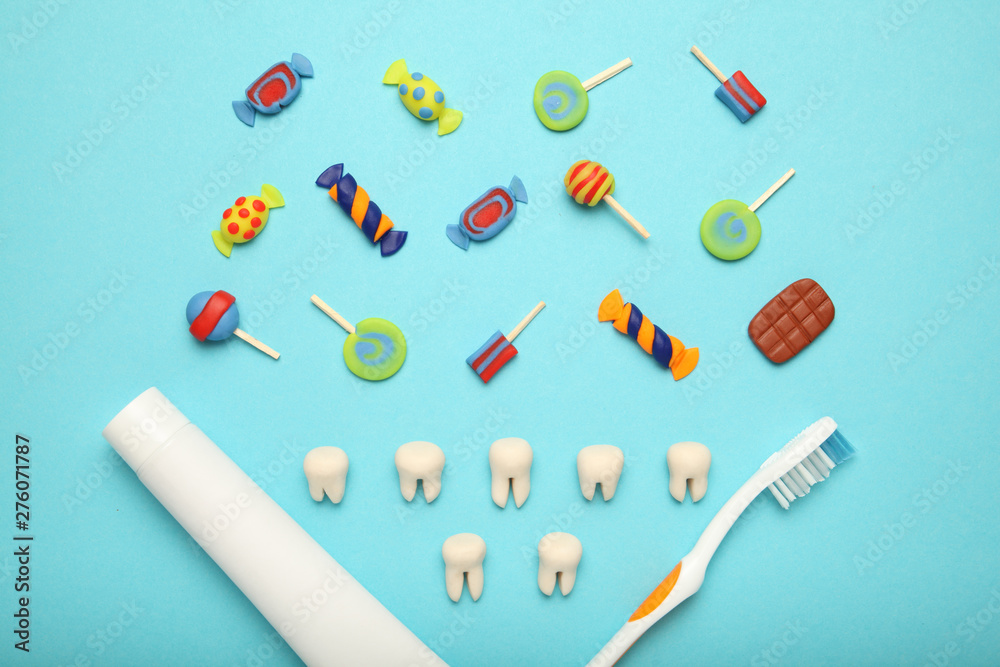 Teeth with sweet candies. Tooth caries in children's, dental healthcare, toothpaste and toothbrush. Teeth with sweet candies. Tooth caries in children's, dental healthcare, toothpaste and toothbrush.