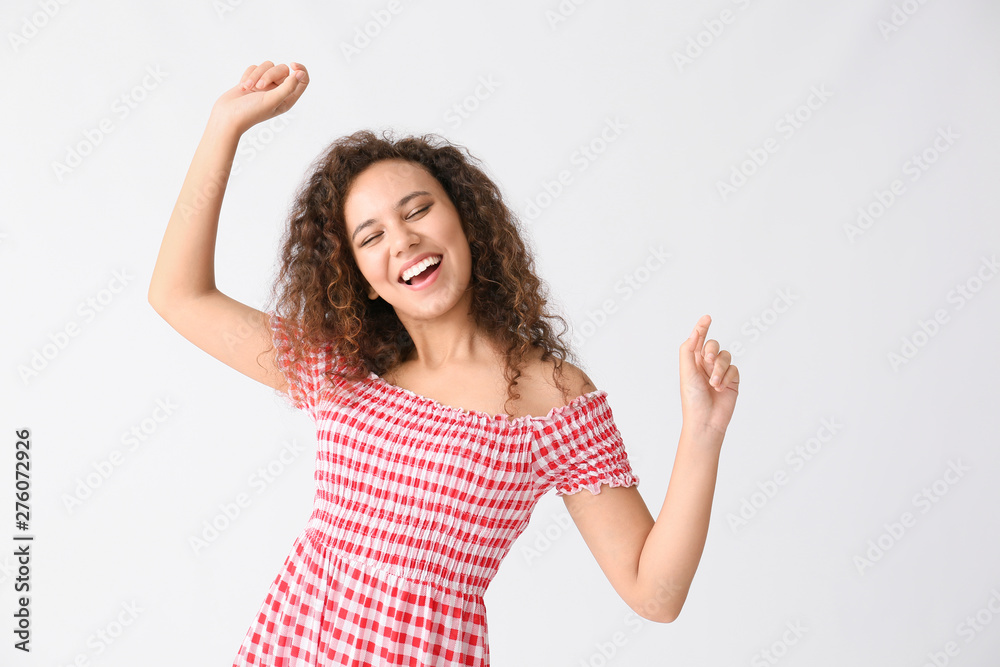 Dancing African-American woman on white background Dancing African-American woman on white background