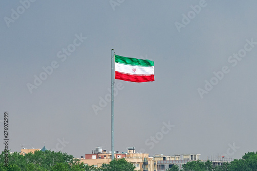 View of the Iranian flag from Khaju Bridge over the Zayandeh river