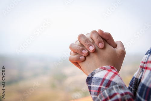 Obraz na plátně Christian woman  hands praying to god on the mountain background with morning sunrise