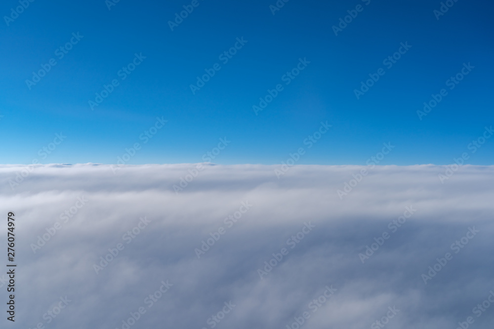 Fototapeta premium View of dark blue sky horizon, up in the air. viewed from an airplane window