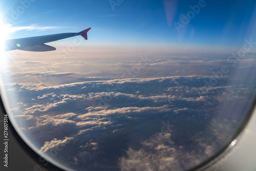 The window of the airplane. A view of porthole window on board an airbus for your travel concept or passenger air transportation