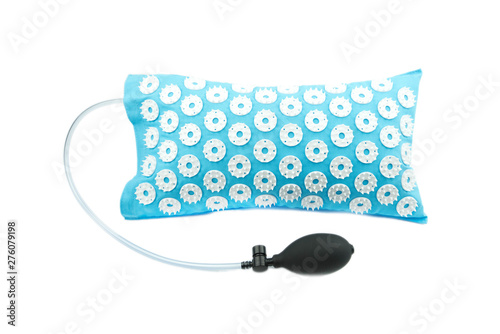 Acupuncture orthopedic massage mat with needles and spikes for feet and body isolated on white background. Alternative medicine, health care, recreation and muscle relaxation concept.