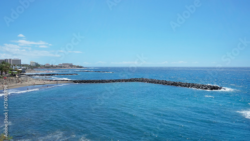 Sunny day in Playa de Las Americas  an lively expansive resort in the south western part of the island  with numerous water attractions  hotels  venues and restaurants  Tenerife  Canary islands  Spain