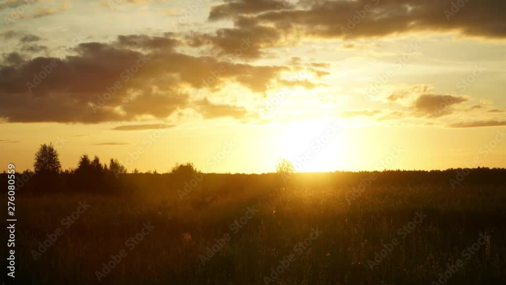 Timelapse of the sunset on a summer evening in the field Timelapse of the sunset on a summer evening in the field