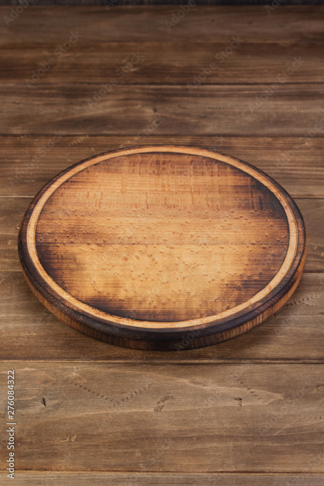 pizza cutting board at rustic wooden table in front pizza cutting board at rustic wooden table in front