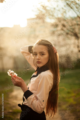 fotography of a girl in nature. Blooming trees. Apricots