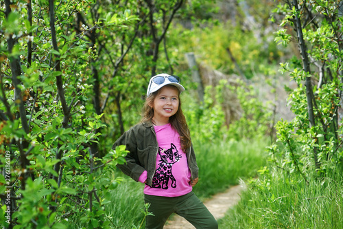 Cheerful little girl on a walk in the Park © fisher05