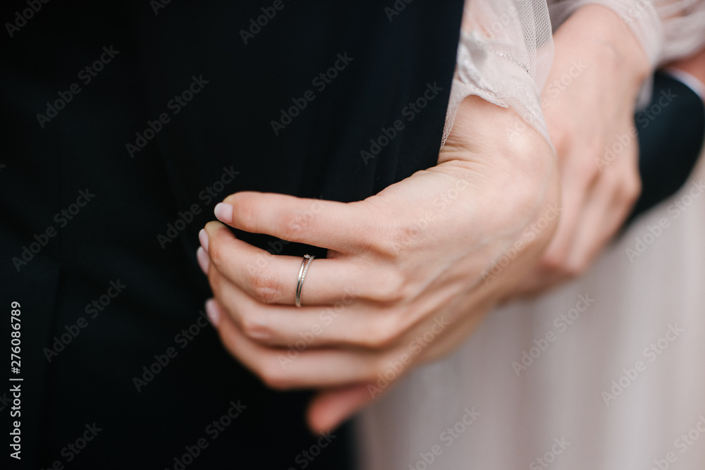 Man and woman hold hands close up Man and woman hold hands close up