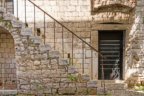 door and stairs. Detail of Romanesque House in historical town Porec, Croatia