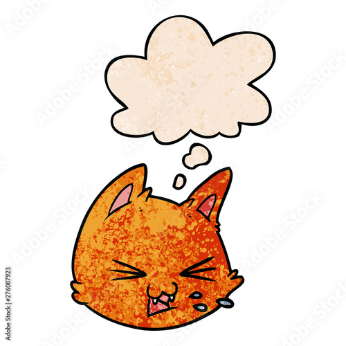spitting cartoon cat face and thought bubble in grunge texture pattern style