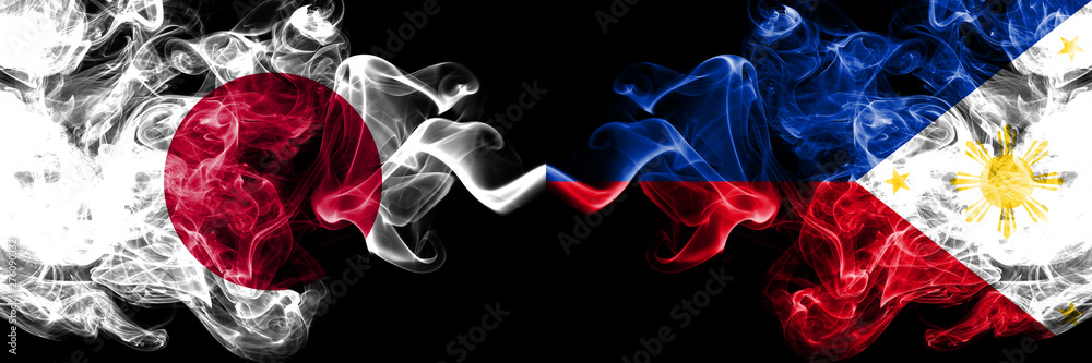 Fototapeta premium Japan vs Philippines, Filipino smoky mystic flags placed side by side. Thick colored silky smokes combination of Philippines, Filipino and Japanese flag