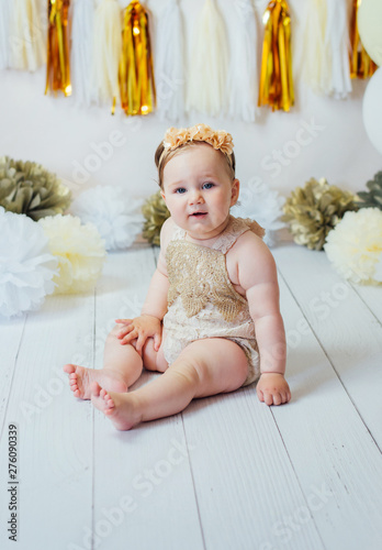 Little happy toddler girl celebrating first birthday