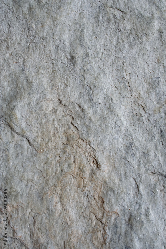 A surface of a architectural stone.(white, gray and brown. rough) A surface of a architectural stone.(white, gray and brown. rough)