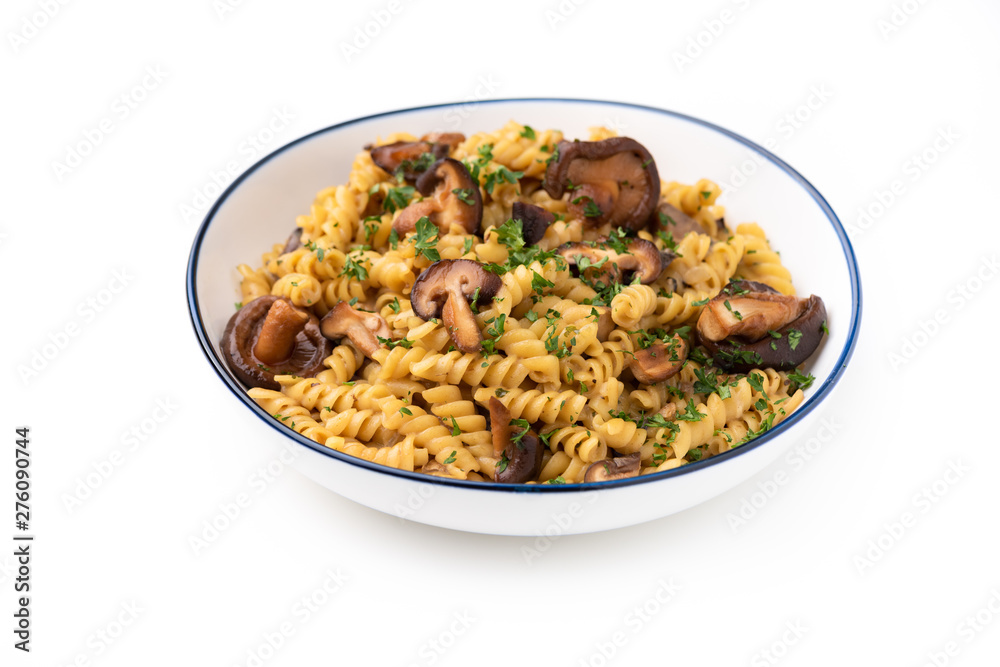 pasta fusilli with Mushroom in Herb sauce on isolated white background pasta fusilli with Mushroom in Herb sauce on isolated white background