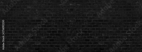 Black brick wall texture and background. Paint brickwork and copy space.