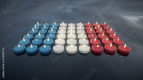 Candles with the colors of the French flag. In memory of the victims.