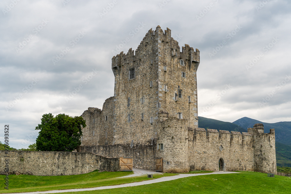 The iconic Ross Castle, stronghold from the Middle Ages, on a cloudy summer day in Killarney, Ireland.