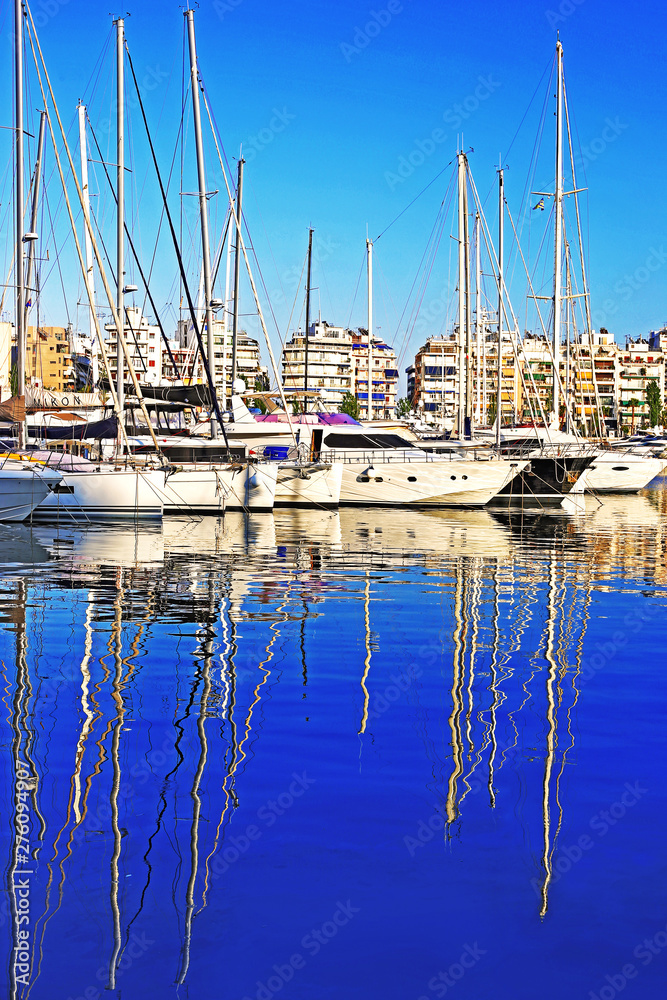 sailboats reflect on water at Piraeus port Greece - water reflection of greek boats