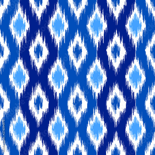 Uzbek ikat silk fabric pattern, indigo blue and white colors.