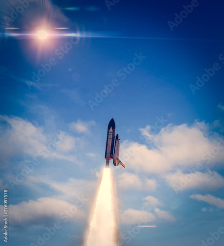 Fototapeta Naklejka Na Ścianę i Meble -  Heavy Carrier Rocket Launch into blue sky. Space mission. Elements of this image furnished by NASA.