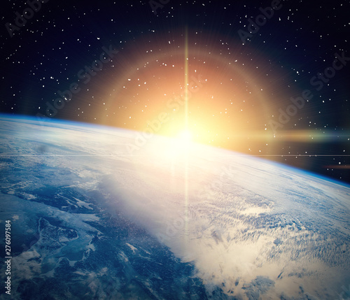 Gorgeous space panorama with the sunrise over the Earth. The elements of this...